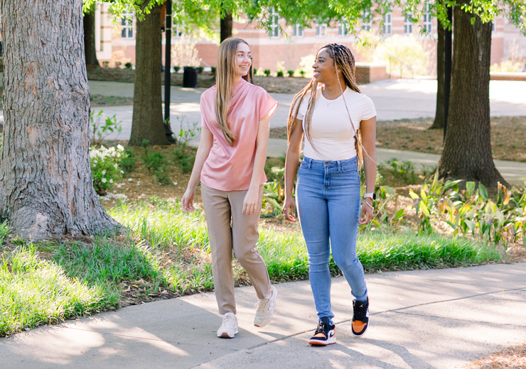 Two female students walking on the Atlanta campus.